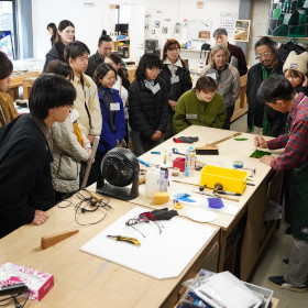 Getting a lecture on stained glass manufacturing at the studio